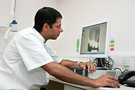 Man examining x-ray