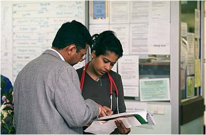 Doctors looking at notes